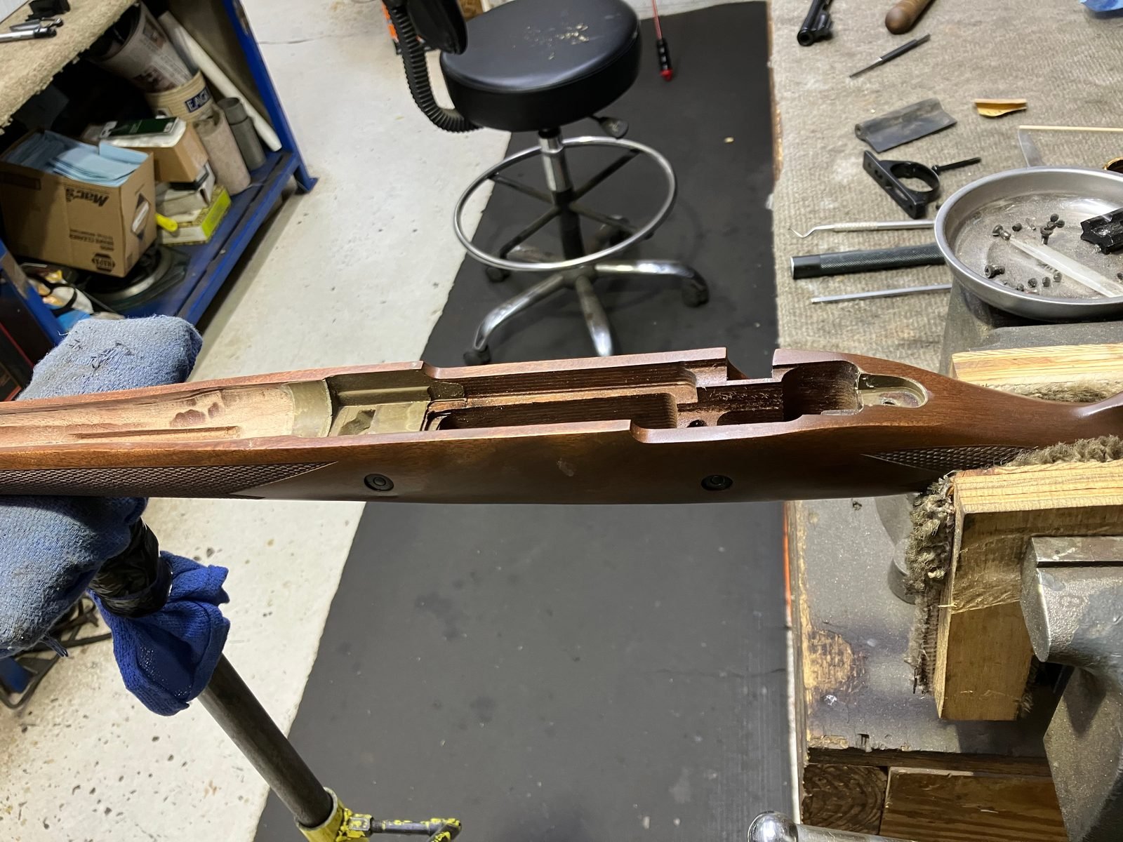 Cured glass bedding in the stock inlet after the action was removed, with the barrel channel opened for free-float
