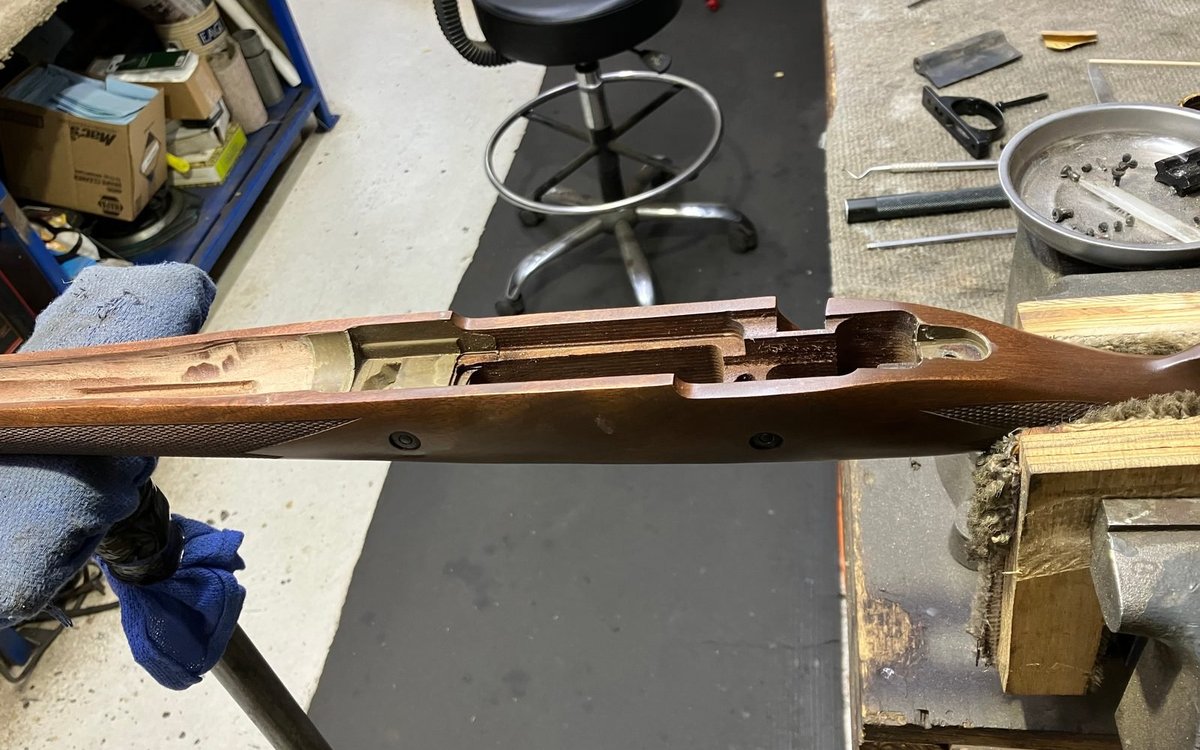 Cured glass bedding in a wood stock inlet with the barrel channel opened for free-float