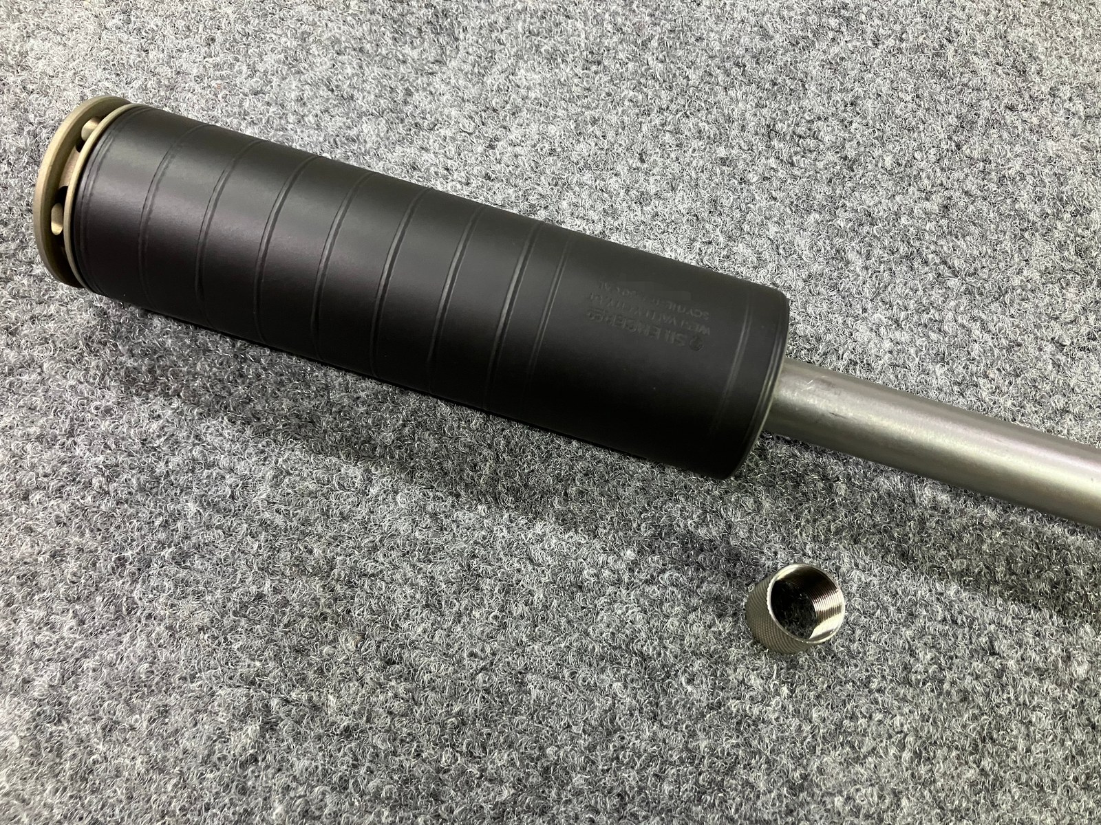 Finished barrel with the customer's suppressor installed, serial obscured